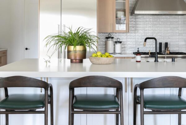 green leather barstools by Jamie Stern