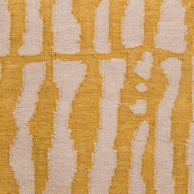 yellow and beige hand-loomed area rug by Jamie Stern