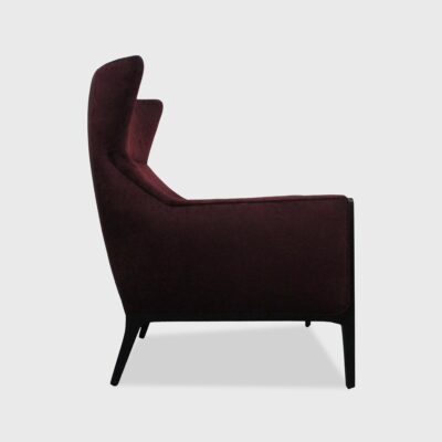 The Bowen Lounge Chair has a wing back and loose seat cushion