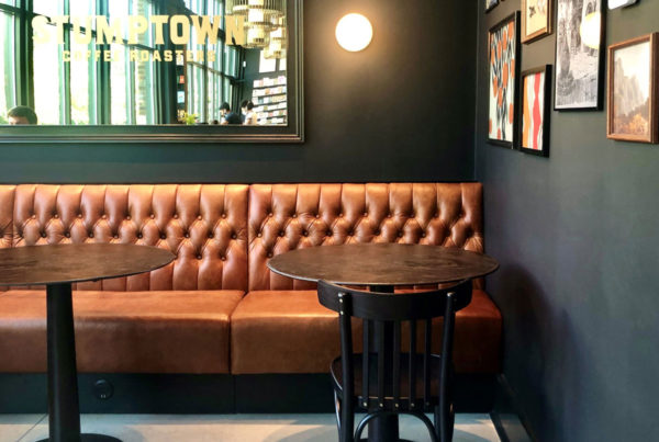 Jamie Stern Delmore brown leather banquette in the Daily Dose Coffee Shop