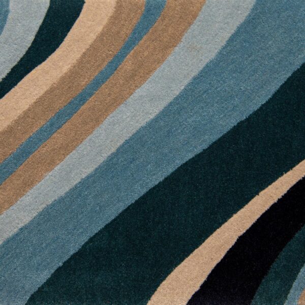 Ebb & Flow is a large wavy blue rug design by Jamie Stern Carpets