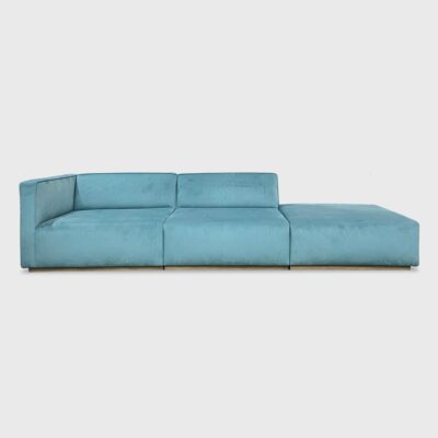 The Elias is a modular sofa featuring a tight back with welt detailing and recessed wood base