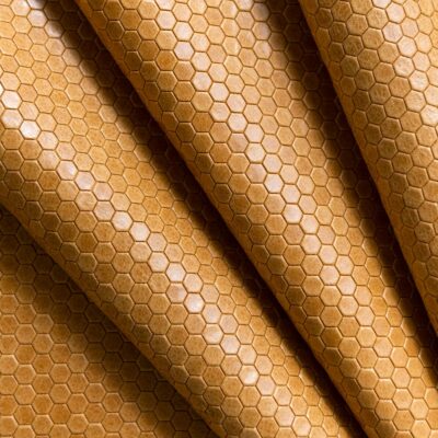 Jamie Stern's new Honeycomb leather blends the rich tactility of pull-up leather with unparalleled embossing precision. The tight hexagon pattern subtly juxtaposes the leather's pure aniline finish and mottled coloration to create a buzzworthy upholstery product suitable for all manner of projects.