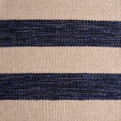 Huntington is a hand-loomed, striped area rug made of 100% New Zealand wool