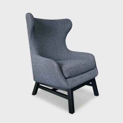 The Jackson features a tight upholstered back, loose seat cushion, and attached back pillow.