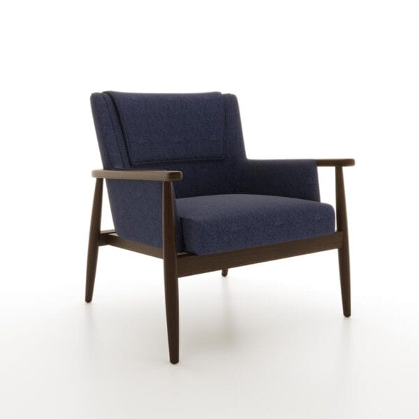 The Landon Lounge Chair from Jamie Stern features a tight upholstered back with a head rest cover, an exposed wood frame and round tapered legs.