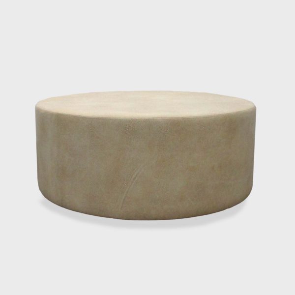 large round leather ottoman by Jamie Stern