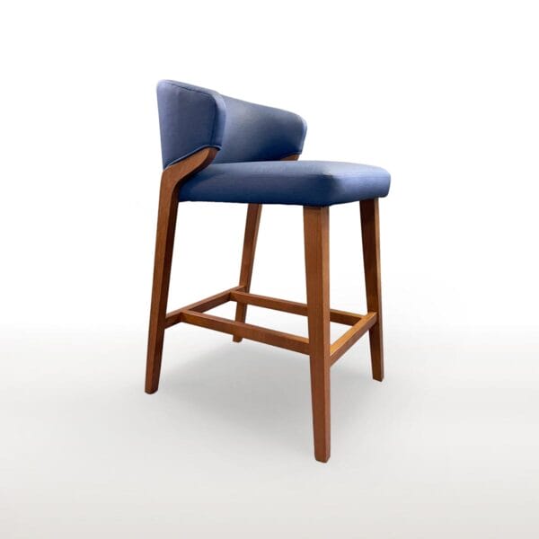 The Lorelei Barstool features a tight seat and back with square tapered legs, a wood "H" stretcher and metal footrest.