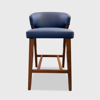 The Lorelei Barstool features a tight seat and back with square tapered legs, a wood "H" stretcher and metal footrest.