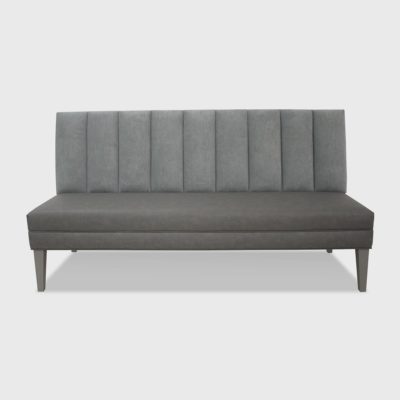 Channeled banquette with tightly upholstered, vertical-channeled inback