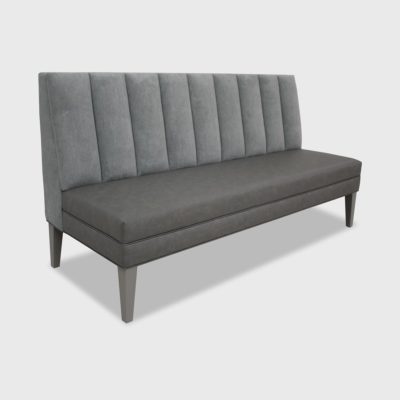 Channeled banquette with tightly upholstered, vertical-channeled inback