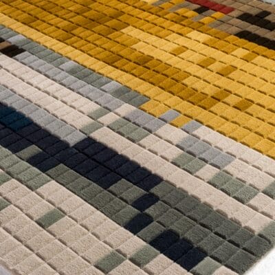 Prism by Samantha Roa is a geometric area rug made of 100% New Zealand wool