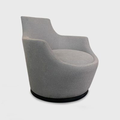 The Rio Swivel Lounge Chair from Jamie Stern features a tight seat and back, as well as a finished wood base.