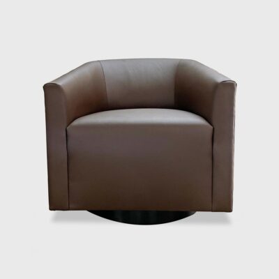Barrel back swivel lounge chair upholstered in Jamie Stern's Celeste PU in the colorway Morning Joe